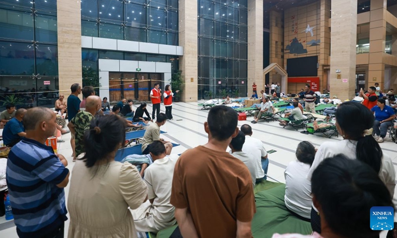Residents stay at a shelter in Yueqing City, east China's Zhejiang Province, on July 11, 2026.