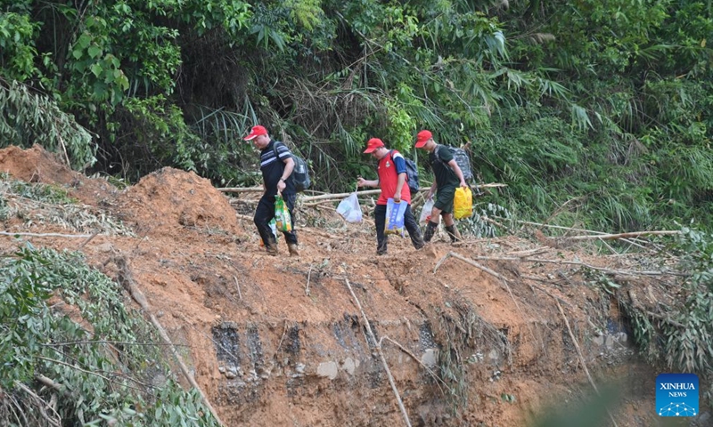 A rescue team delivers emergency supplies in Zhenlong Township, Hengzhou City, Nanning, south China's Guangxi Zhuang Autonomous Region, July 10, 2026.

