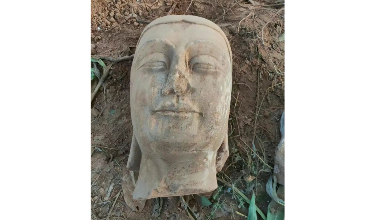 The stone Buddha head sculpture found in Dongzhao village in Fengyang, North China's Shanxi province Photo: Jimu News
