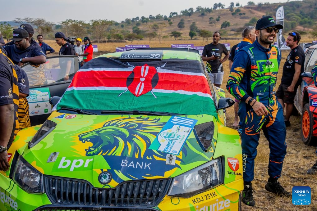 Kenya's Karan Patel stands and poses for a picture near his Skoda Fabia R5 that gave him the victory as the African Rally Champion during the Rwanda Mountain Gorilla Rally in Bugesera, Rwanda, July 12, 2026. The Rwanda Mountain Gorilla Rally is one of four official rounds of the 2026 FIA African Rally Championship. (Photo by Cyril Ndegeya/Xinhua)
