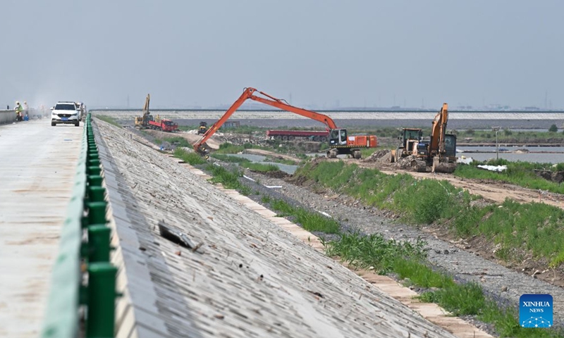 This photo taken on July 12, 2026 shows a construction site of the first phase of a coastal seawall project in Binhai New Area in Tianjin, north China. The first phase of the coastal seawall project in Binhai New Area was fully completed. Stretching 3.4 kilometers, the new seawall boasts a crest elevation of 9.2 meters, approximately 2 meters higher than the original one, enabling it to better cope with the combined risks of typhoons, rainstorms and storm surges. (Xinhua/Zhao Zishuo)