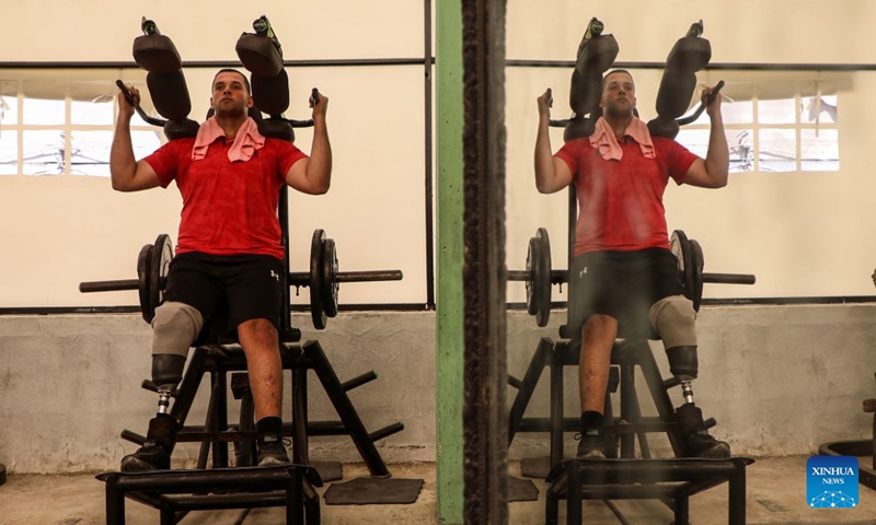 Palestinian bodybuilding coach Mahmoud Abu Madkour on a prosthetic leg exercises at the modest Al-Sakhra gym in al-Nuseirat refugee camp in the central Gaza Strip, on July 8, 2026. (Photo by Rizek Abdeljawad/Xinhua)

