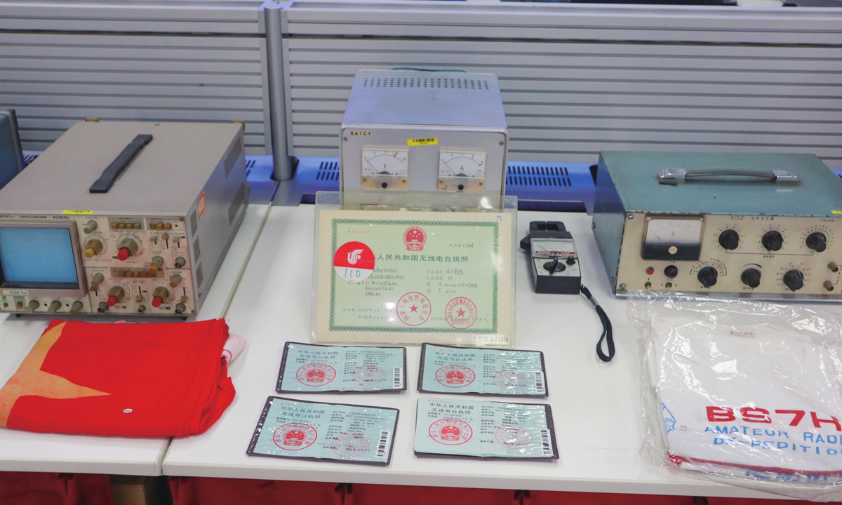 A Chinese national flag, credentials, and radio appliances used in the Huangyan Dao DX-peditions Photo: Courtesy of Chen Ping