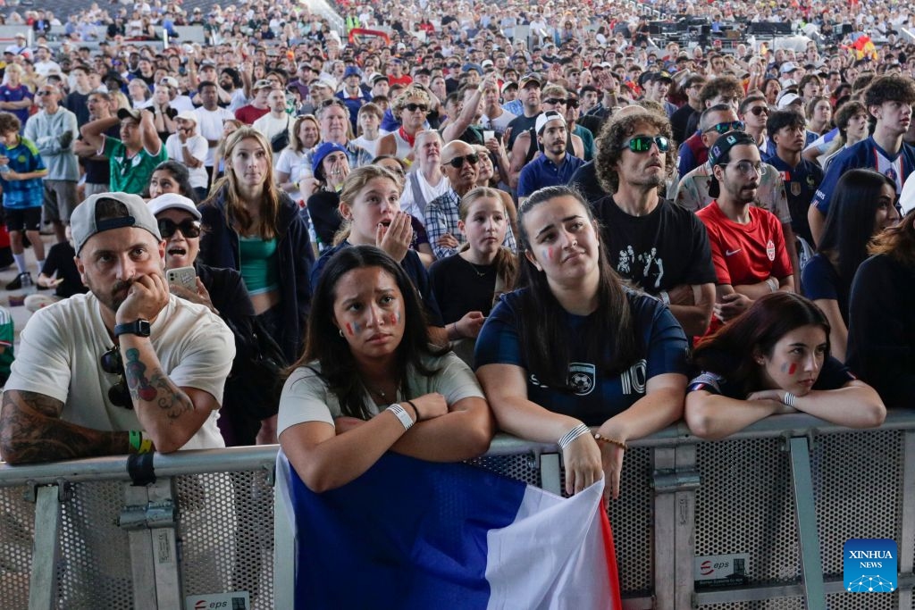 Fans of Team France react during the semifinal match of the 2026 FIFA World Cup between France and Spain at the FIFA Fan Festival in Vancouver, Canada, July 14, 2026. Thousands of football fans gathered at the FIFA Fan Festival to watch the first semifinal of the 2026 FIFA World Cup. Spain defeated France 2-0 to advance to the World Cup final. (Photo: Xinhua)