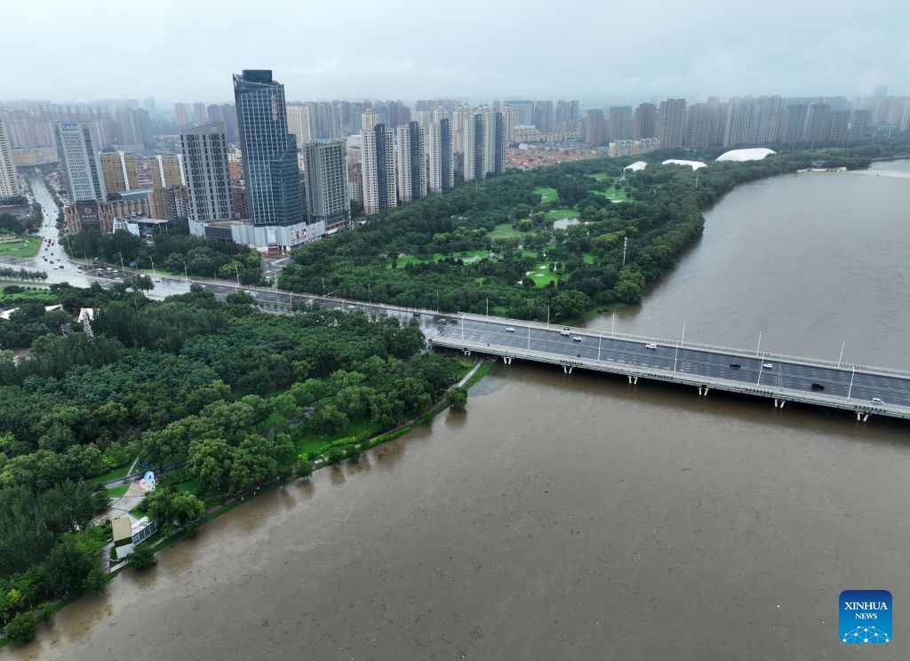 An aerial drone photo taken on July 13, 2026 shows a section of the Hunhe River in Shenyang, northeast China's Liaoning Province. From Sunday to Monday, heavy to torrential rain lashed central Liaoning Province. Several cities, including Shenyang and Fushun, suspended classes, business operations and work on Monday as a precaution, while water levels in several rivers rose significantly due to the heavy rainfall. (Photo: Xinhua)