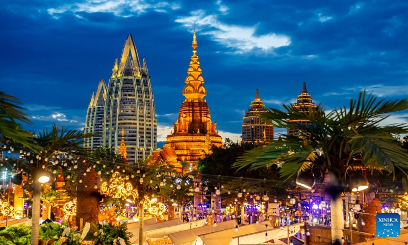 This photo taken on July 14, 2026 shows a view of the Starlight Night Market in Jinghong, Xishuangbanna Dai Autonomous Prefecture, southwest China's Yunnan Province. The Starlight Night Market, located in Jinghong of Xishuangbanna Dai Autonomous Prefecture, has witnessed a surge in visitor arrivals during the summer peak tourism season. Featuring local delicacies, ethnic culture and diverse nighttime consumption options, this night market reflects the vitality of local cultural and tourism market. (Photo: Xinhua)