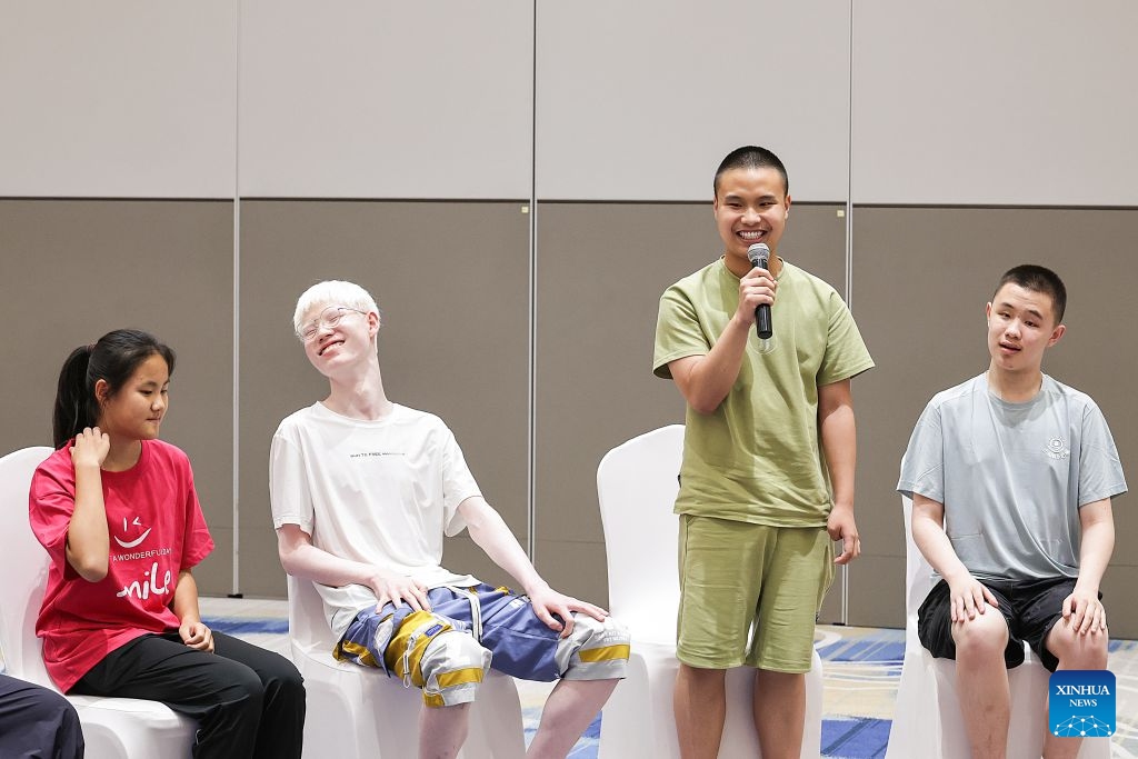 A boy speaks during a summer camp event in Beijing, capital of China, July 12, 2026. UNICEF China on Sunday invited world diving gold medalist Chen Yuxi to a summer camp event here attended by children with visual impairments, in an effort to help children with disabilities discover their potential and raise public awareness of protecting their rights. (Photo: Xinhua)