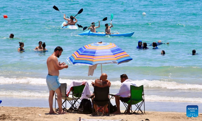 People enjoy themselves on a beach in Tyre, Lebanon, July 12, 2026. (Photo: Xinhua)