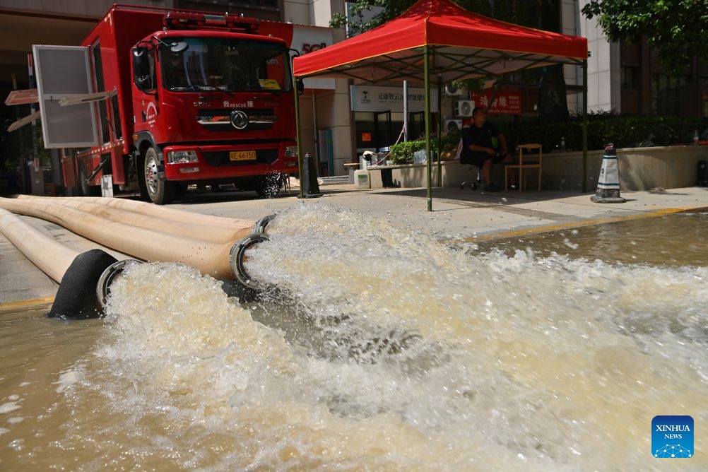 Water is pumped out at a community in Guigang City, south China's Guangxi Zhuang Autonomous Region, July 13, 2026. As Typhoon Maysak recedes, Guigang City has initiated efforts to pump out water, clear sludge, and restore power supply, striving to bring people's production and daily life back to normal. (Photo: Xinhua)
