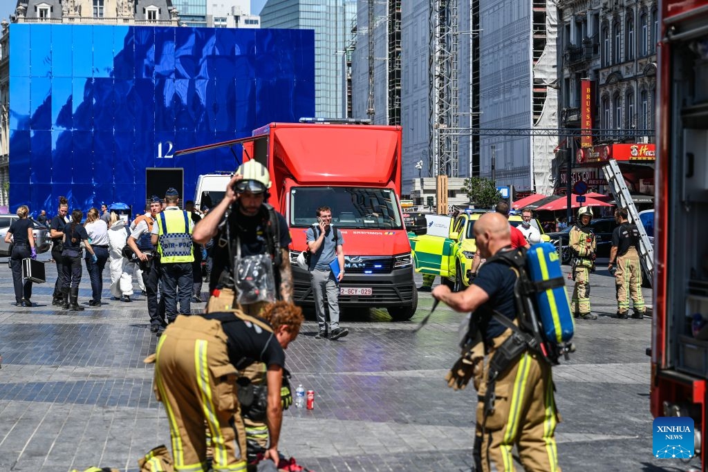 Firefighters work near the fire site of the Oxy building on De Brouckere Square, Brussels, Belgium, July 14, 2026. Multiple people have died on Tuesday in a fire at the well-known Oxy building on De Brouckere Square, in the center of Brussels. (Photo: Xinhua)