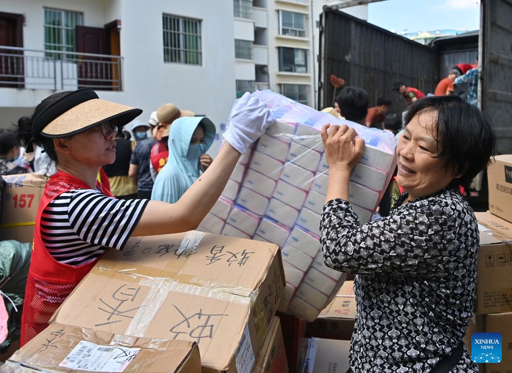 Volunteers transfer relief supplies at a charity federation in Nanning, south China's Guangxi Zhuang Autonomous Region, July 12, 2026. Efforts are underway to support flood relief and recovery in Guangxi, which has been hit by severe rainstorms and flooding caused by Typhoon Maysak. (Photo: Xinhua)