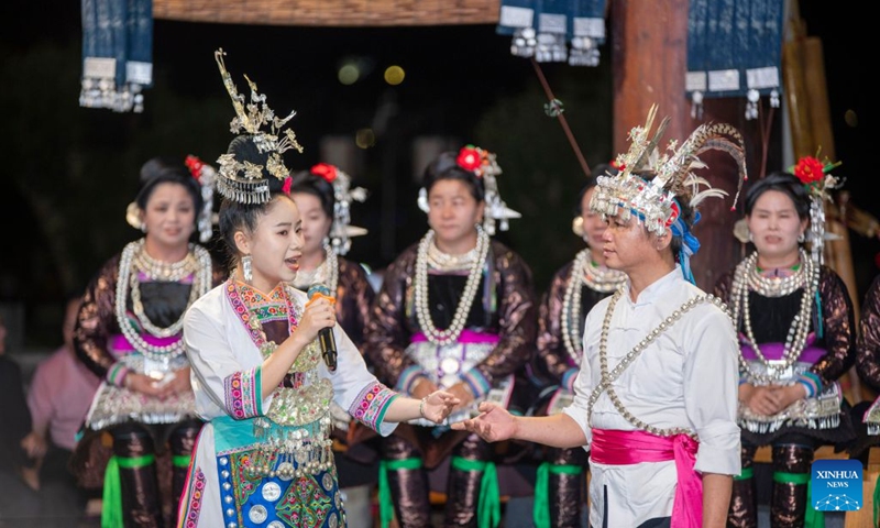 People of the Dong ethnic group perform during a musical event in Congjiang County of southwest China's Guizhou Province, July 12, 2026. The event featuring performing arts of the Dong ethnic group and local specialty foods was held here on Sunday, attracting hundreds of tourists. (Photo: Xinhua)