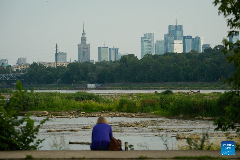 Low water levels expose shallow areas of the Vistula River in Warsaw, Poland, July 13, 2026. Poland's longest river, the Vistula, has fallen to historically low water levels amid drought. Recent data from the Institute of Meteorology and Water Management showed that the river level at the Warsaw-Bulwary monitoring station had dropped to 19 centimeters, far below the normal level of around 230 centimeters. (Photo: Xinhua)