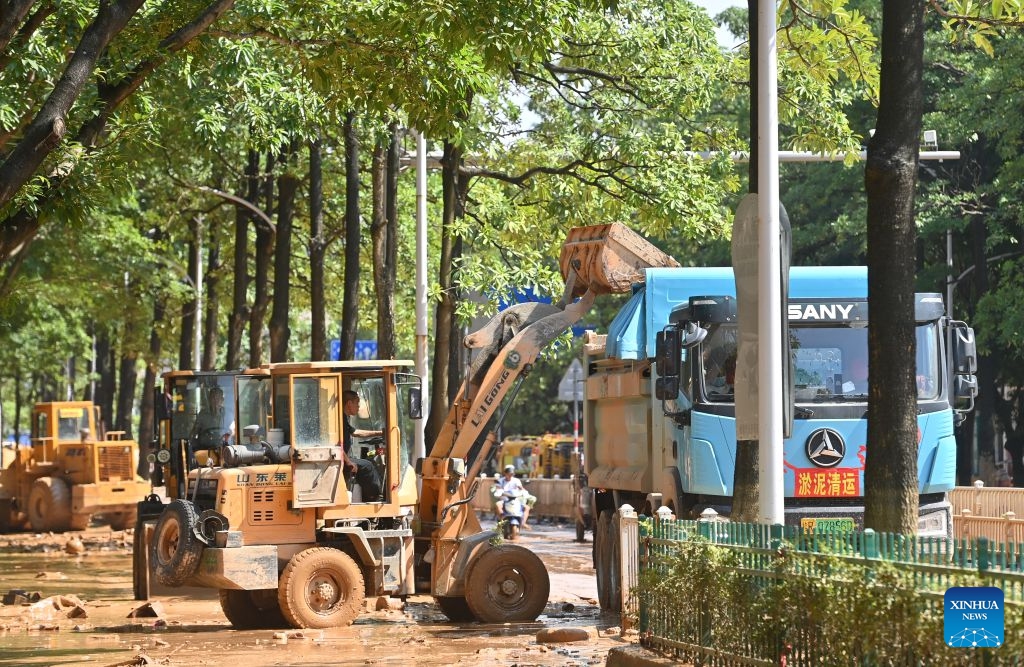 Staff members remove sludge on a street in Guigang City, south China's Guangxi Zhuang Autonomous Region, July 13, 2026. As Typhoon Maysak recedes, Guigang City has initiated efforts to pump out water, clear sludge, and restore power supply, striving to bring people's production and daily life back to normal. (Photo: Xinhua)