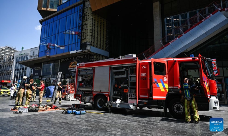 Firefighters arrive at the fire site of the Oxy building on De Brouckere Square, Brussels, Belgium, July 14, 2026. Multiple people have died on Tuesday in a fire at the well-known Oxy building on De Brouckere Square, in the center of Brussels. According to local media, 6 people are still missing. The fire brigade has deployed en masse for a major search and rescue operation. (Photo: Xinhua)