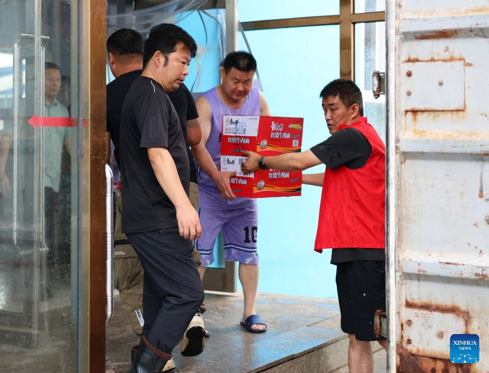 Staff members transfer supplies at a temporary relocation in Kaoshan Town of Kaiyuan City, northeast China's Liaoning Province, July 14, 2026. Recently, heavy rainfall has caused flooding in parts of Liaoning Province. Local officials have worked on the front line to evacuate residents and provide them with temporary relocation. (Photo: Xinhua)
