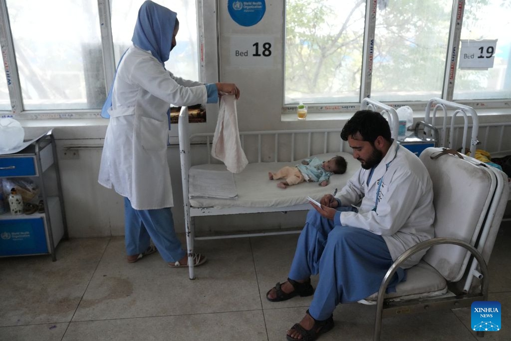 Doctors check on a malnourished child at the Indira Gandhi Institute of Child Health in Kabul, Afghanistan, July 13, 2026. The UN Children's Fund (UNICEF) has raised the alarm that 3.7 million children under the age of 5 in Afghanistan are at heightened risk of malnutrition, according to a new report issued on Sunday. (Photo: Xinhua)
