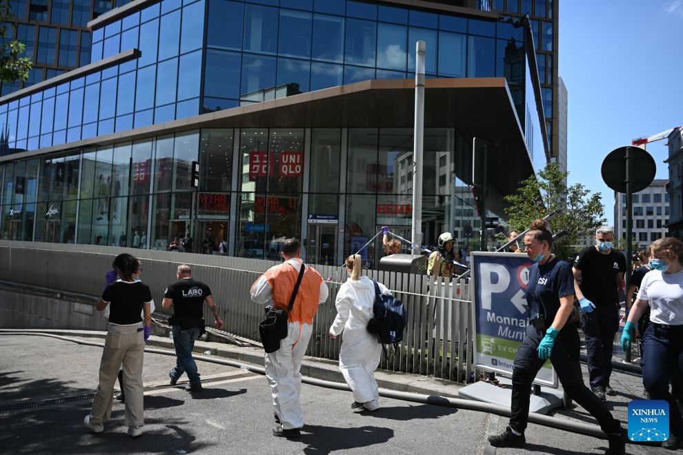 Police officers are seen at the fire site of the Oxy building on De Brouckere Square, Brussels, Belgium, July 14, 2026. Multiple people have died on Tuesday in a fire at the well-known Oxy building on De Brouckere Square, in the center of Brussels. According to local media, 6 people are still missing. The fire brigade has deployed en masse for a major search and rescue operation. (Photo: Xinhua)