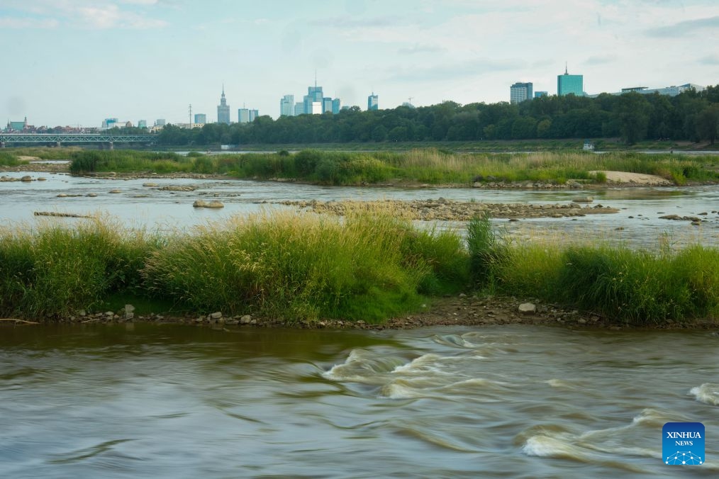 Water flows between exposed sandbanks in the Vistula River in Warsaw, Poland, July 13, 2026. Poland's longest river, the Vistula, has fallen to historically low water levels amid drought. Recent data from the Institute of Meteorology and Water Management showed that the river level at the Warsaw-Bulwary monitoring station had dropped to 19 centimeters, far below the normal level of around 230 centimeters. (Photo: Xinhua)