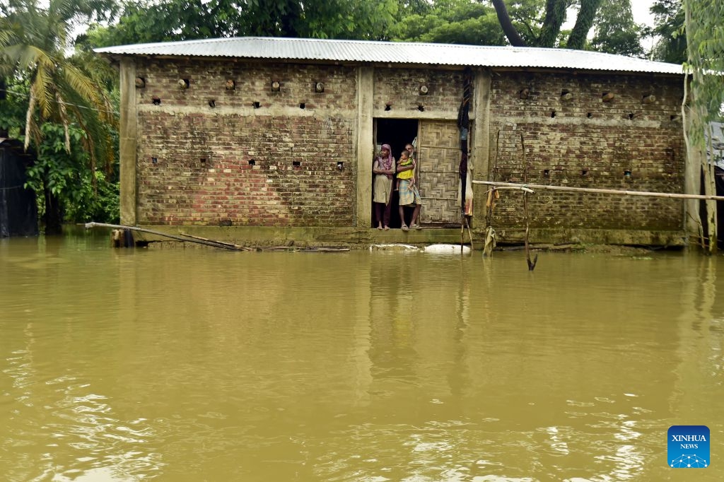 People are marooned by floodwater in Cox's Bazar district, Bangladesh, July 12, 2026. Floods that have swept parts of Bangladesh for about a week have killed 51 people, said a senior official on Sunday. According to the latest daily disaster situation report released by the country's Ministry of Disaster Management and Relief, more than 1.02 million people were marooned by floods in seven out of the country's total 64 districts. (Photo: Xinhua)