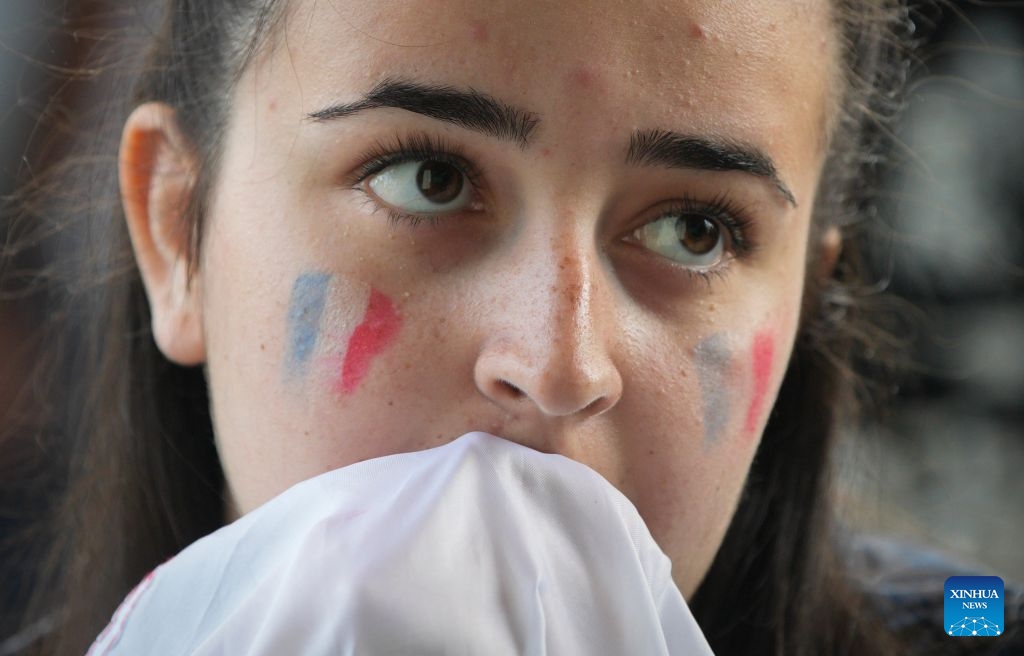 A fan of Team France reacts during the semifinal match of the 2026 FIFA World Cup between France and Spain at the FIFA Fan Festival in Vancouver, Canada, July 14, 2026. Thousands of football fans gathered at the FIFA Fan Festival to watch the first semifinal of the 2026 FIFA World Cup. Spain defeated France 2-0 to advance to the World Cup final. (Photo: Xinhua)