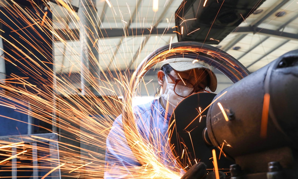 A worker polishes bicycle components for export at a workshop of a foreign trade company in Lin'an district of Hangzhou, East China's Zhejiang Province, on July 15, 2026. Photo: VCG