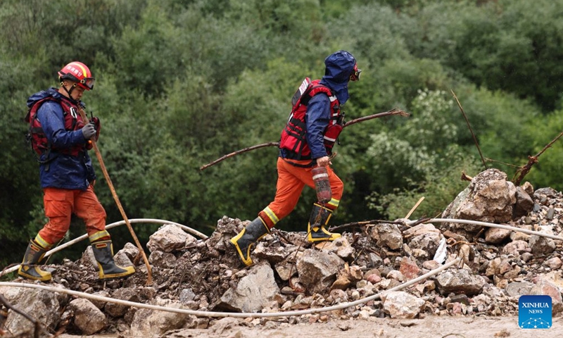 Rescuers work at the flood-hit area in Weiyuan County, northwest China's Gansu Province, July 27, 2026. The flash flood, triggered by sudden heavy rainfall, hit a scenic area in Weiyuan County, Dingxi City, on Sunday afternoon, leaving 10 people dead and 23 injured as of 6 p.m.

