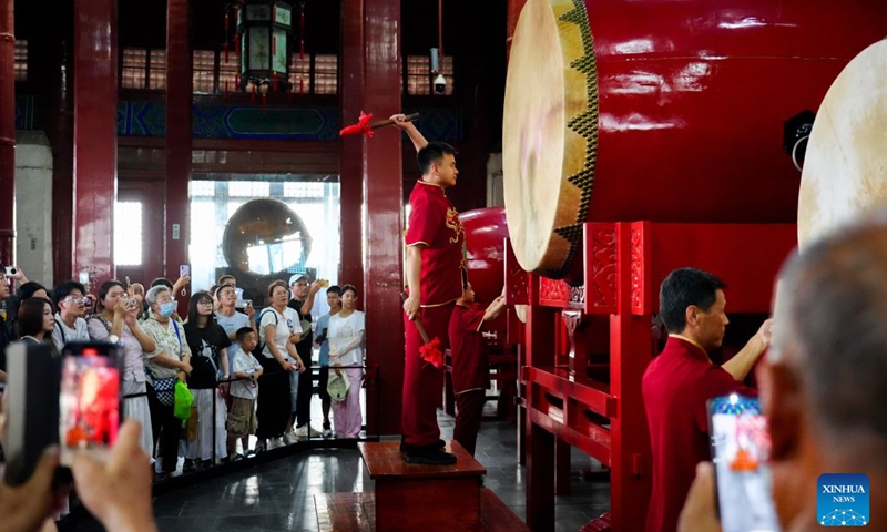 People watch a performance on the Drum Tower in Beijing, capital of China, July 27, 2026. 