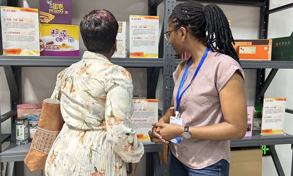 Two members of the Namibian delegation look at some products being showcased at Hongqiao Import Commodity Exhibition and Trade Center in Shanghai on July 2, 2026. Photo: Huang Lanlan/GT