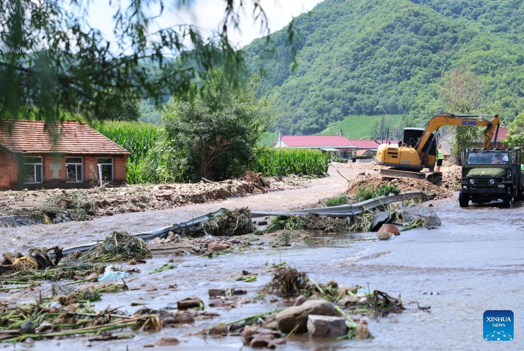 Staff members clear a road in Zengjiazhai Village of Kaiyuan City, northeast China's Liaoning Province, July 15, 2026. On Tuesday, China's national commission for disaster prevention, reduction and relief activated a Level-IV national disaster relief emergency response for Liaoning Province, which was hit by rainstorms and flooding. China has a four-tier emergency response system, with Level I being the most severe. (Photo: Xinhua)