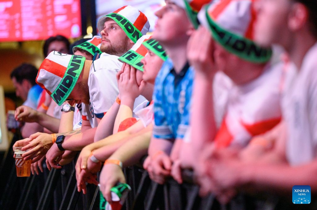 England football fans react while watching the live broadcast of the semifinal of the 2026 FIFA World Cup between England and Argentina at Box Park venue Wembley in London, Britain, July 15, 2026. (Photo: Xinhua)
