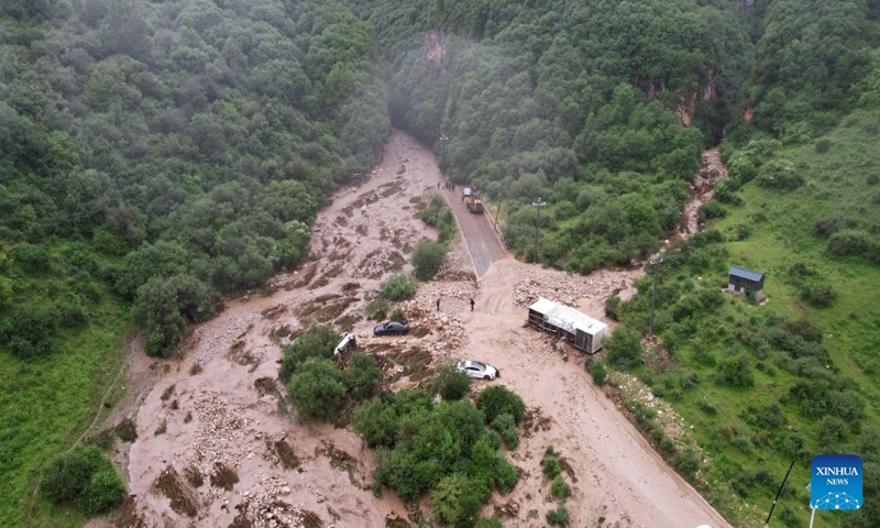 An aerial drone photo taken on July 27, 2026 shows the flood-hit area in Weiyuan County, northwest China's Gansu Province. The flash flood, triggered by sudden heavy rainfall, hit a scenic area in Weiyuan County, Dingxi City, on Sunday afternoon, leaving 10 people dead and 23 injured as of 6 p.m.

