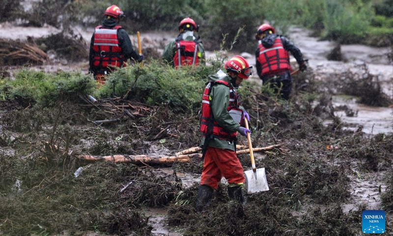 Rescuers work at the flood-hit area in Weiyuan County, northwest China's Gansu Province, July 27, 2026. The flash flood, triggered by sudden heavy rainfall, hit a scenic area in Weiyuan County, Dingxi City, on Sunday afternoon, leaving 10 people dead and 23 injured as of 6 p.m.


