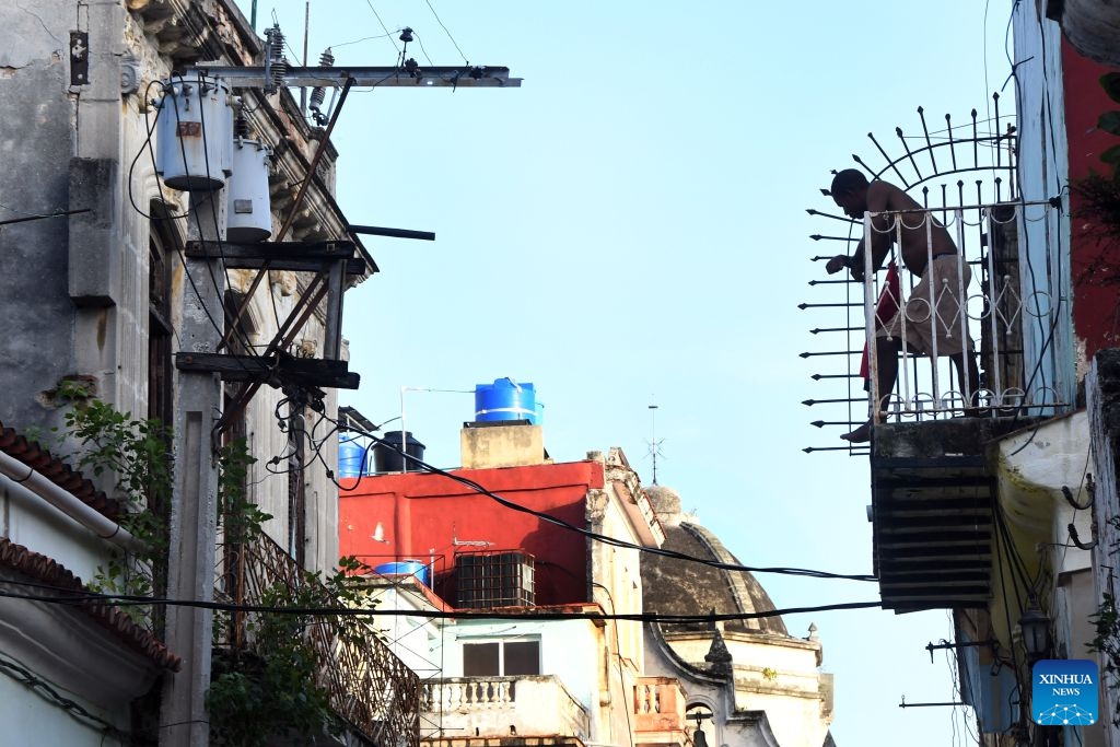 A man stands on the balcony during a nationwide blackout in Havana, capital of Cuba, July 14, 2026. Cuba was hit by a third nationwide blackout in a little over a week on Tuesday, the National Electric Union said. (Photo: Xinhua)