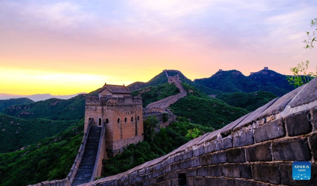 This photo shows a view of the Jinshanling section of the Great Wall at sunrise at Luanping County of Chengde City, north China's Hebei Province, July 16, 2026. (Photo: Xinhua)