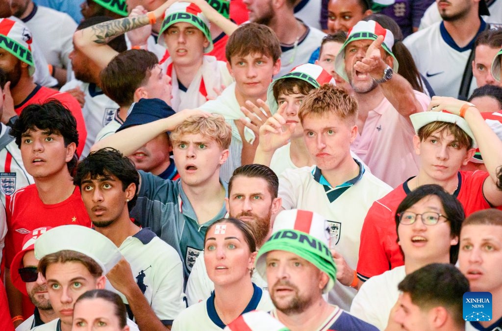 England football fans react while watching the live broadcast of the semifinal of the 2026 FIFA World Cup between England and Argentina at Box Park venue Wembley in London, Britain, July 15, 2026. (Photo: Xinhua)
