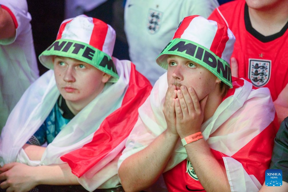 England football fans react while watching the live broadcast of the semifinal of the 2026 FIFA World Cup between England and Argentina at Box Park venue Wembley in London, Britain, July 15, 2026. (Photo: Xinhua)