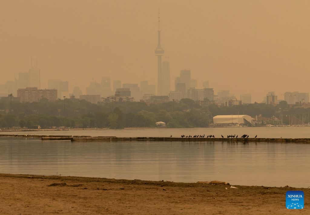 Wildfire smoke from northwestern Ontario fills the sky in Toronto, Canada, on July 15, 2026. Wildfires sweeping across northwestern Ontario, Canada, in recent days have caused severe smog and a sharp deterioration in air quality in several regions, including Ottawa, the nation's capital, and Toronto, Canada's largest city. (Photo: Xinhua)