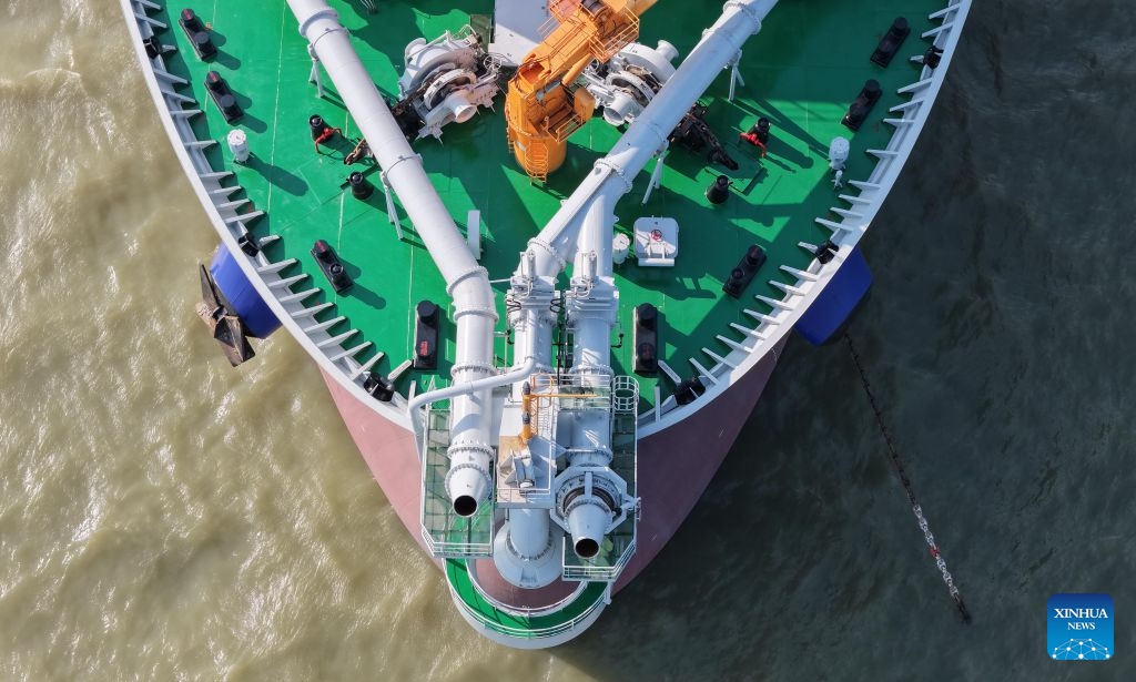 An aerial drone photo taken on May 27, 2026 shows the adjustable dual bow jetting system of the Junguang dredger at the Pearl River Estuary area, in south China's Guangdong Province. The Junguang, a mega dredger with a 35,000 cubic meter capacity, was recently put into operation. Measuring 198 meters in length, with a maximum dredging depth of 120 meters and a deadweight of 60,483 tonnes, the vessel is the largest of its kind in Asia. (Photo: Xinhua)