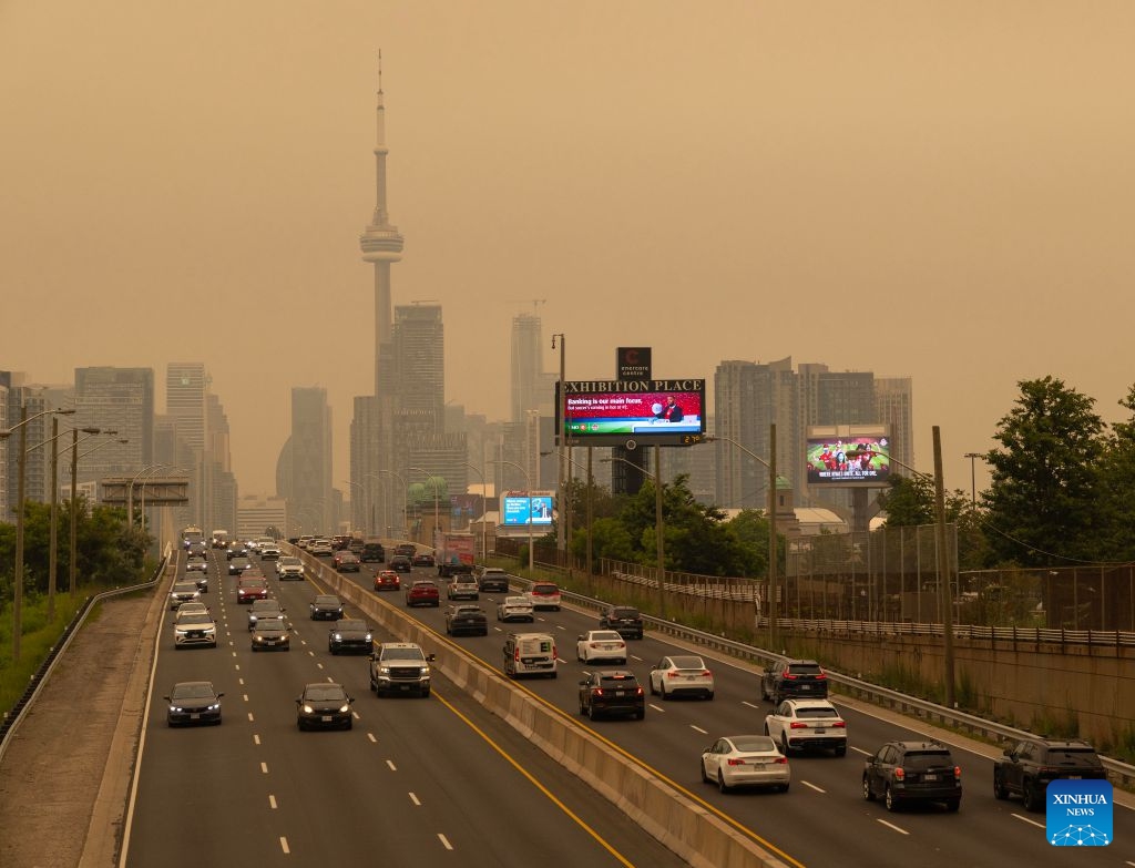 Wildfire smoke from northwestern Ontario fills the sky in Toronto, Canada, on July 15, 2026. Wildfires sweeping across northwestern Ontario, Canada, in recent days have caused severe smog and a sharp deterioration in air quality in several regions, including Ottawa, the nation's capital, and Toronto, Canada's largest city. (Photo: Xinhua)