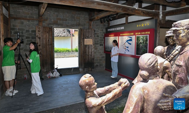 Students from Fujian Agriculture and Forestry University visit a red culture exhibition hall in Zhongfu Village of Changting County, southeast China's Fujian Province, July 24, 2026.