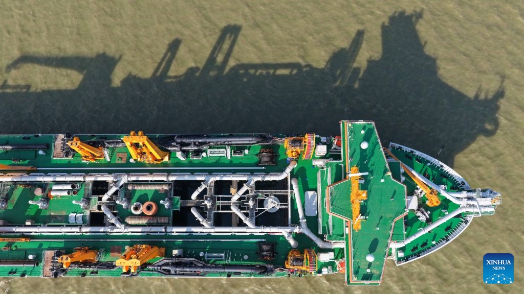 An aerial drone photo taken on May 27, 2026 shows the Junguang dredger at the Pearl River Estuary area, in south China's Guangdong Province. The Junguang, a mega dredger with a 35,000 cubic meter capacity, was recently put into operation. Measuring 198 meters in length, with a maximum dredging depth of 120 meters and a deadweight of 60,483 tonnes, the vessel is the largest of its kind in Asia. (Photo: Xinhua)