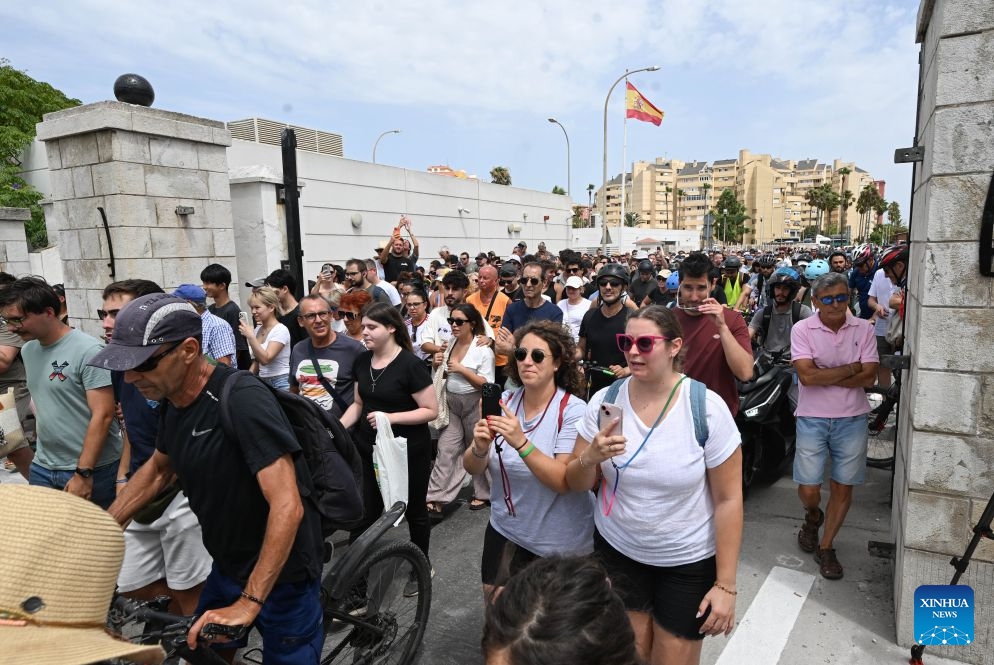 People walk across the land border crossing between Gibraltar and Spain, on July 15, 2026. Routine border checks at the Spain-Gibraltar land crossing were lifted in the early hours of Wednesday, in line with new border arrangements under the post-Brexit agreement between the European Union and Britain. (Photo: Xinhua)