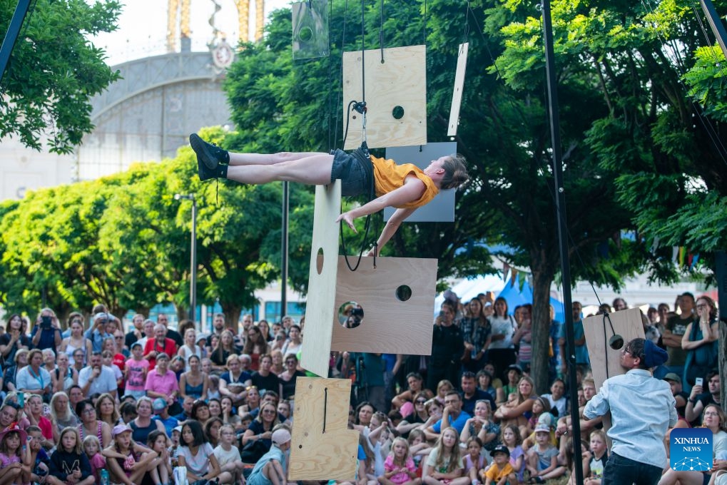 An artist performs during the street theater festival Behind the Door in Prague, the Czech Republic, July 16, 2026. The Prague street theater festival Behind the Door is held here from July 14 to 19, bringing together street theater, contemporary circus, music, acrobatics and other performances from multiple countries. (Photo by Dana Kesnerova/Xinhua)