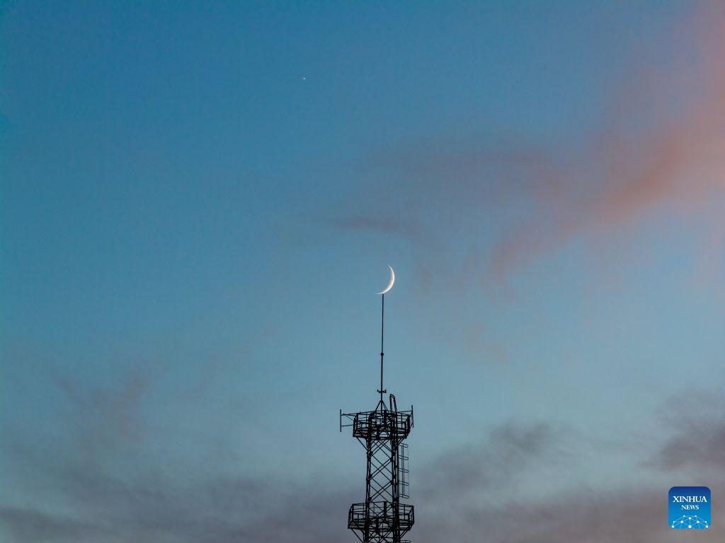 A drone photo taken on July 17, 2026 shows the moon and Venus in Harbin, northeast China's Heilongjiang Province. (Photo: Xinhu)