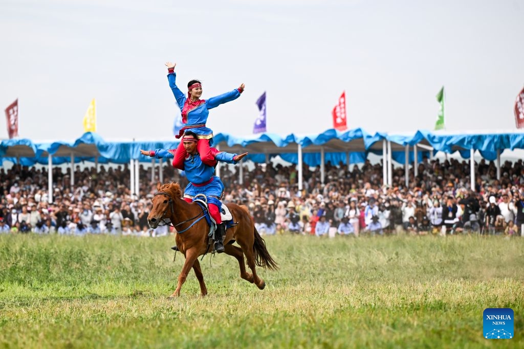 Artists perform on horseback at the opening ceremony of the 36th Naadam festival in Xilin Gol League, north China's Inner Mongolia Autonomous Region, July 18, 2026. The Naadam festival kicked off here on Saturday. Naadam, usually held in mid-summer and sometimes in winter in pastoral areas of Inner Mongolia, means games in the Mongolian language. It often comprises wrestling, archery, and horse racing, also known as the Three Games of Men. (Photo: Xinhu)