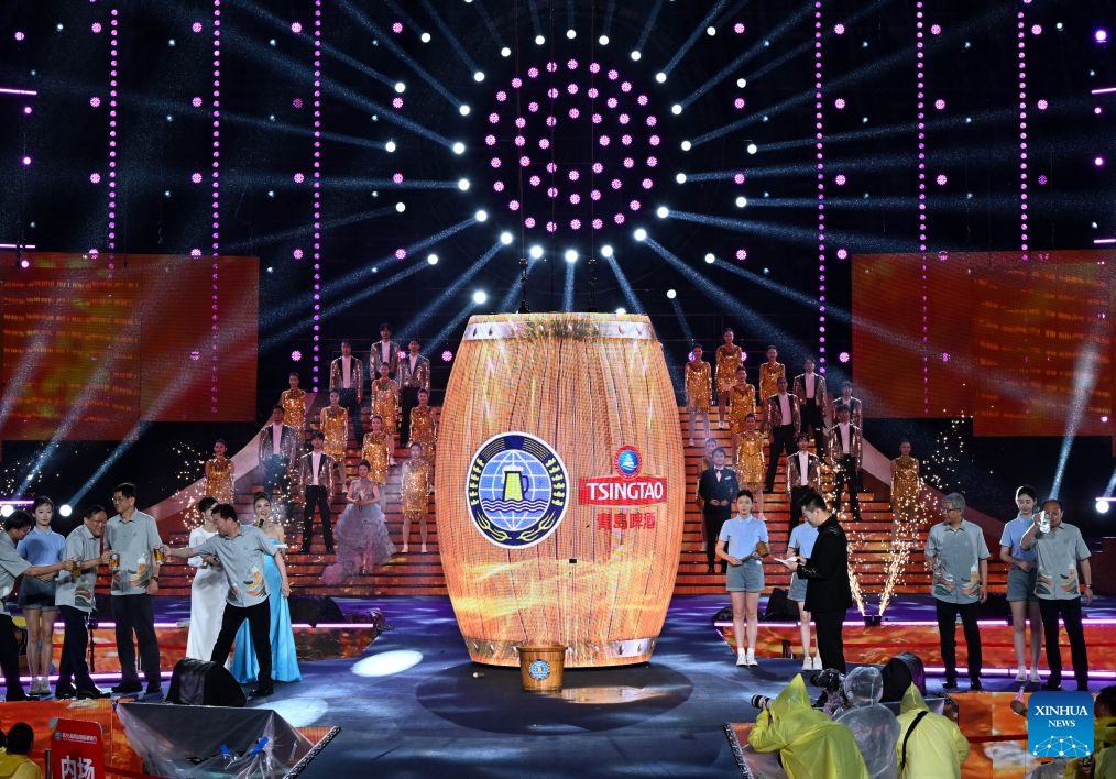 Guests attend the ceremonial tapping of the first beer barrel during the opening of the 36th Qingdao International Beer Festival at Xihai'an (West Coast) New Area in Qingdao, east China's Shandong Province, on July 17, 2026. The 36th Qingdao International Beer Festival opened on Friday evening in the coastal city of Qingdao, east China's Shandong Province, kicking off a 30-day celebration that blends brewing tradition with tech advances and cultural performances. Running until Aug. 15, the festival boasts nine beer tents offering more than 2,300 varieties from around the world, including premium craft brews and fruit-flavored beers. (Photo: Xinhu)
