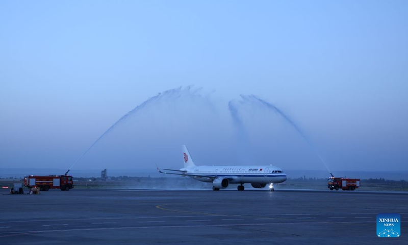 Flight CA893 passes through a water gate at the Manas International Airport in Bishkek, Kyrgyzstan, July 17, 2026. Air China's inaugural direct flight between the capitals of China and Kyrgyzstan officially launched on Friday after flight CA893, departing from Beijing Capital International Airport, successfully landed at Manas International Airport in Bishkek. According to Air China, regular flights in both directions of the new air service operate three times a week, namely on Mondays, Fridays, and Sundays. Flight CA893 departs from Beijing and travels to Bishkek, with a flight time of five hours 40 minutes; flight CA894 departs from Bishkek and travels to Beijing, with a flight time of four hours 50 minutes. Photo: Xinhua