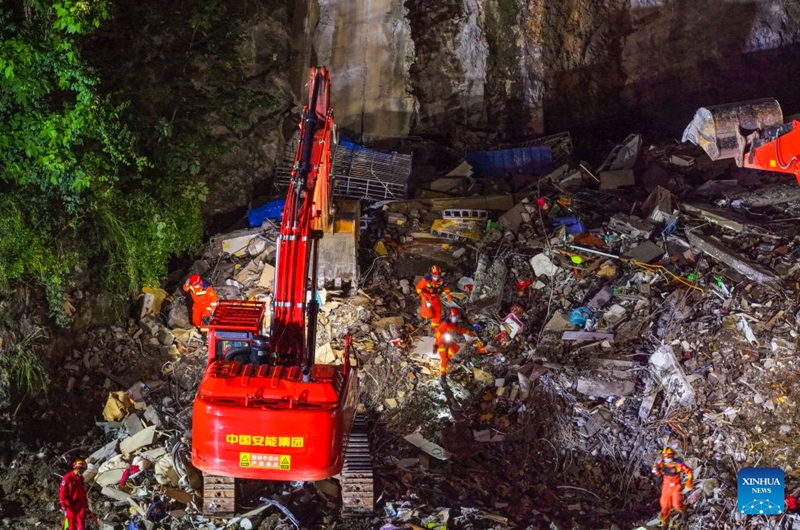 An aerial drone photo taken on July 18, 2026 shows rescuers working at the site of a landslide in Pengshui Miao and Tujia Autonomous County, southwest China's Chongqing Municipality. The geological disaster occurred at 9:08 a.m. on Friday in the Hanjia sub-district of Pengshui Miao and Tujia Autonomous County in Chongqing, burying more than 10 residential buildings. Search and rescue operations are still underway. (Xinhua/Huang Wei)