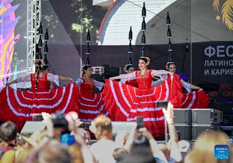 Performers dance during a festival of Latin American and Caribbean culture at Hermitage Garden in Moscow, Russia, July 18, 2026. Featuring live music, performance and traditional cuisines, the festival kicked off here on Saturday and will run until July 26. (Xinhua/Feng Kaihua)